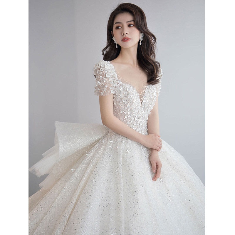 Luxury Short Sleeve Wedding Dress 2023 New Bridal Dress V Neck Beading Shinning Ball Gown Sweep Train