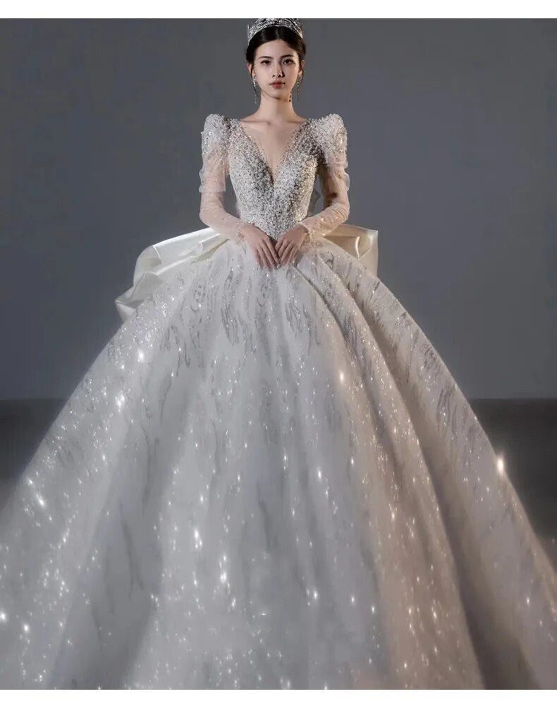 Long Sleeved Bridal Dress Back Up Bow Sweep Train Beading Wedding Gown V-neck