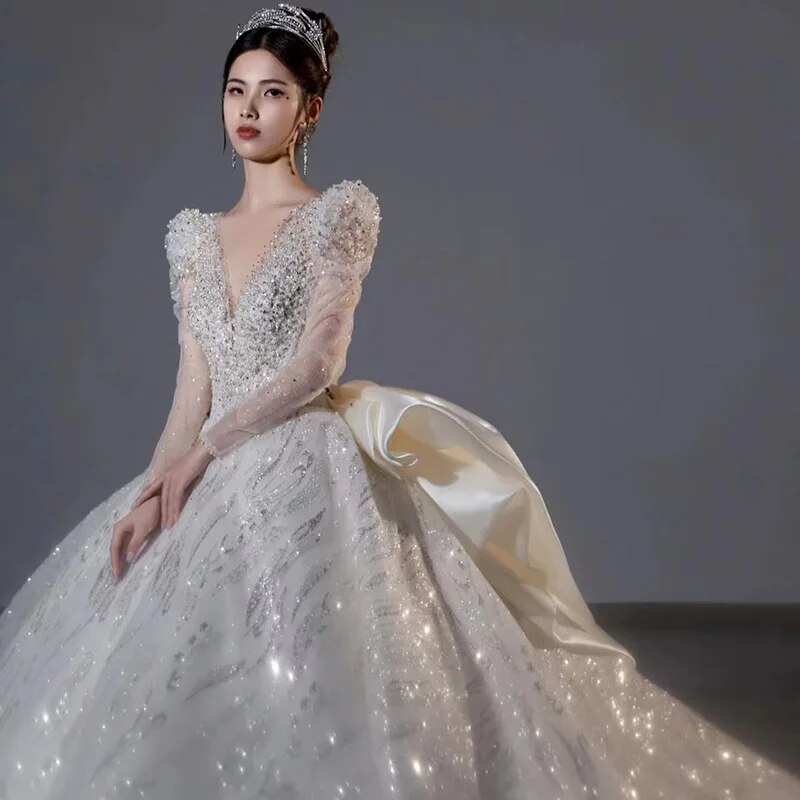 Long Sleeved Bridal Dress Back Up Bow Sweep Train Beading Wedding Gown V-neck