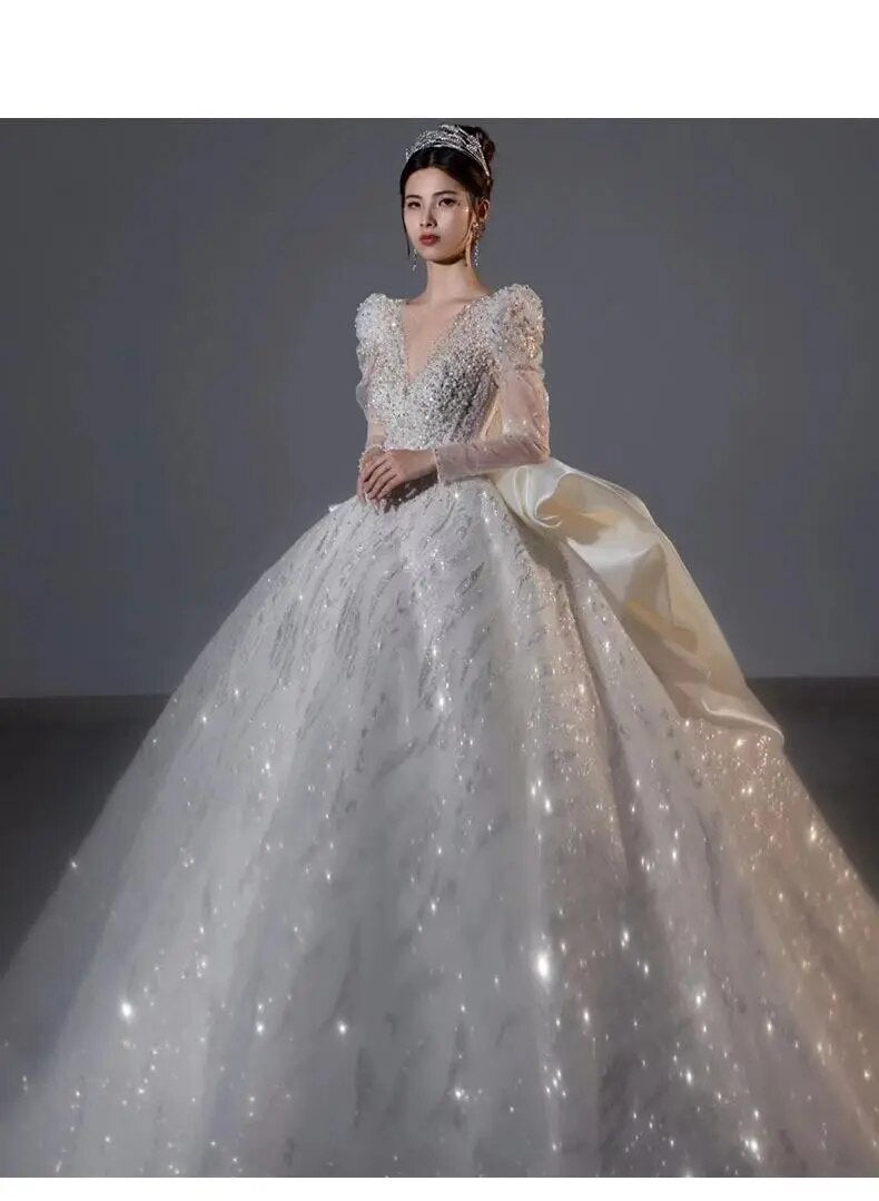 Long Sleeved Bridal Dress Back Up Bow Sweep Train Beading Wedding Gown V-neck