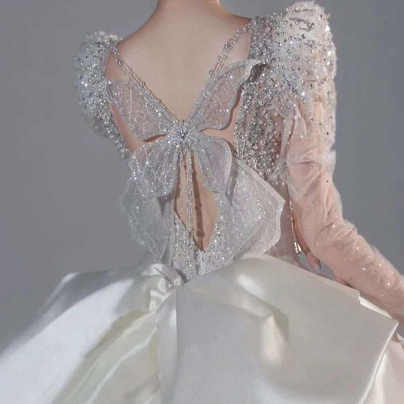 Long Sleeved Bridal Dress Back Up Bow Sweep Train Beading Wedding Gown V-neck