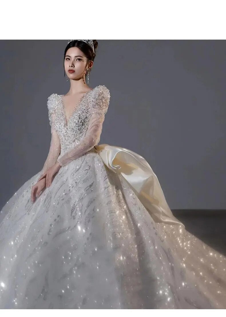 Long Sleeved Bridal Dress Back Up Bow Sweep Train Beading Wedding Gown V-neck