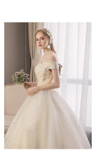 Load image into Gallery viewer, 2023 Off White Sexy Boat Neck Wedding Dress Beautiful Lace Flower Ball Gown Off The Shoulder Princess Bridal Dress Custom Made
