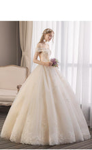 Load image into Gallery viewer, 2023 Off White Sexy Boat Neck Wedding Dress Beautiful Lace Flower Ball Gown Off The Shoulder Princess Bridal Dress Custom Made
