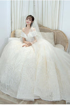 Load image into Gallery viewer, Shining Sequins Luxury Wedding Dress With Sweep Train Elegant Boat Neck Off The Shoulder Ball Gown
