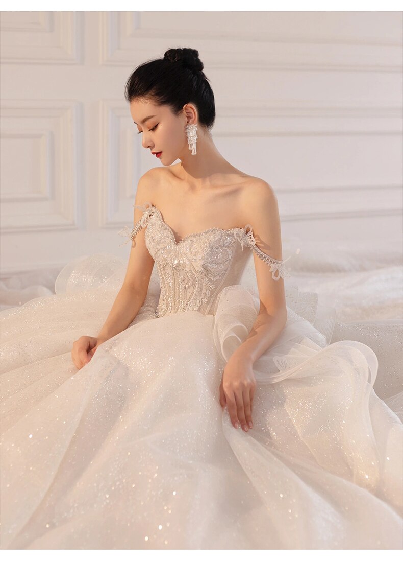 Luxury Sling Wedding Dress Boat Neck Glittery Pearls Lace Dress
