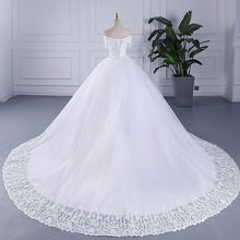 Load image into Gallery viewer, Luxury Crystal Beaded Wedding Dresses New Plus Size White Cap Sleeve Wedding Gown Pretty Lace On Neck Africa Style Wedding Dress
