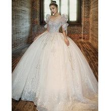 Load image into Gallery viewer, Luxury Beading Lace Wedding Dress 2023 V Neck Puff Sleeve Princess Wedding Gown With Big Sweep Train Plus Size Wedding Dress
