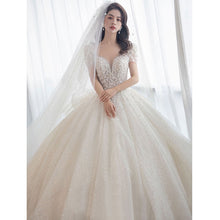 Load image into Gallery viewer, Luxury Short Sleeve Wedding Dress 2023 New Bridal Dress V Neck Beading Shinning Ball Gown Sweep Train
